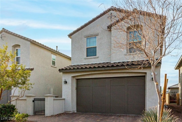 mediterranean / spanish house with a garage