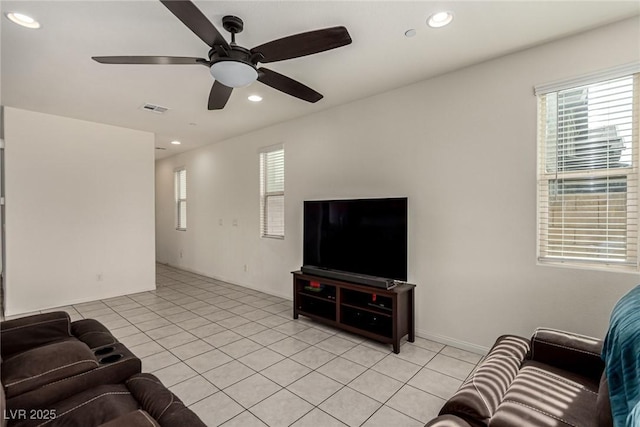 living room featuring ceiling fan and light tile patterned floors