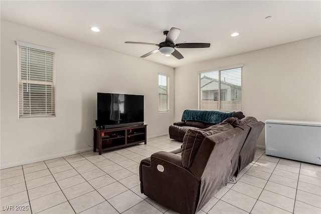 living room featuring ceiling fan and light tile patterned flooring