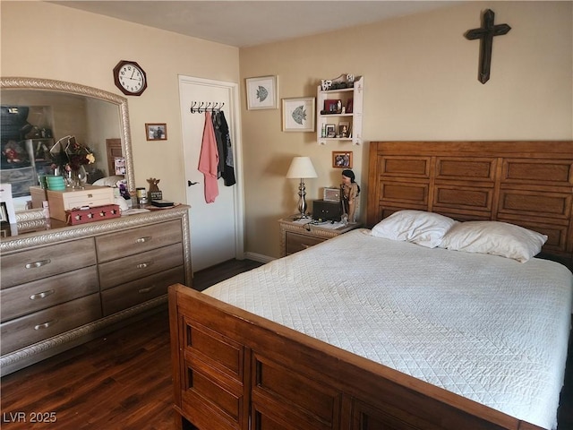 bedroom featuring dark hardwood / wood-style flooring