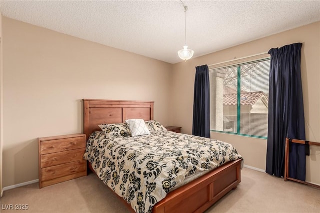 carpeted bedroom featuring a textured ceiling