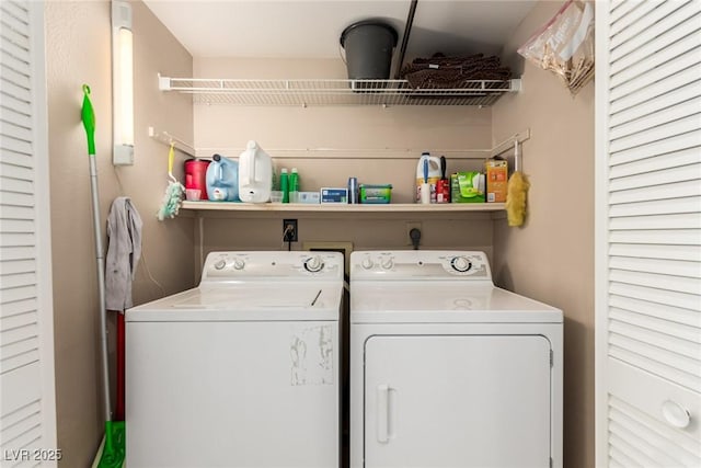 clothes washing area with separate washer and dryer