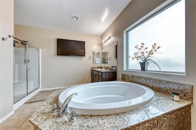 bathroom with vanity and independent shower and bath