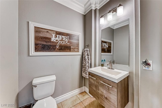 bathroom with crown molding, tile patterned floors, toilet, and vanity