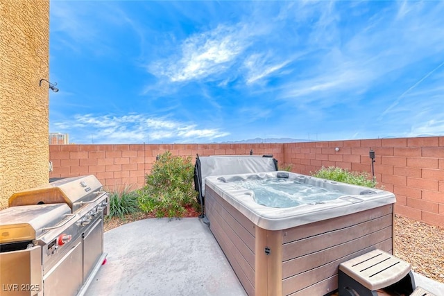 view of patio / terrace featuring a hot tub