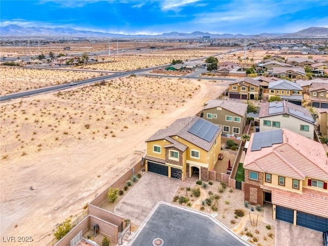 birds eye view of property with a mountain view