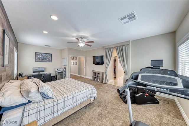 bedroom with ceiling fan and light carpet