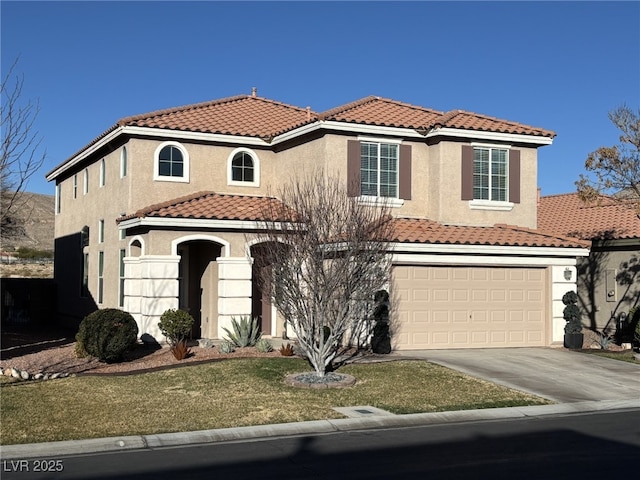 mediterranean / spanish house with driveway, a tile roof, an attached garage, a front lawn, and stucco siding