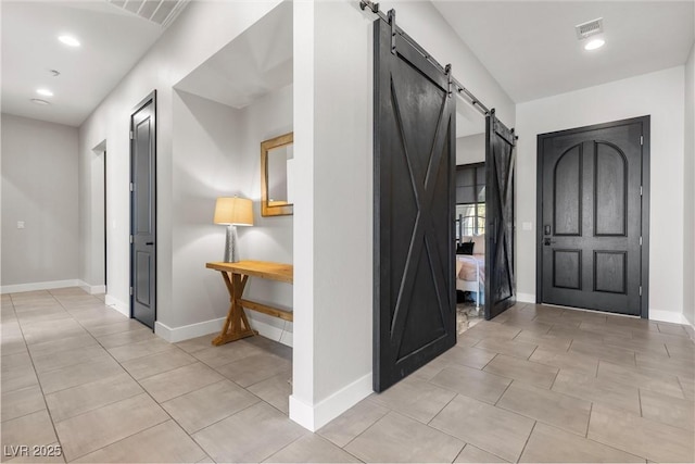 foyer entrance featuring a barn door