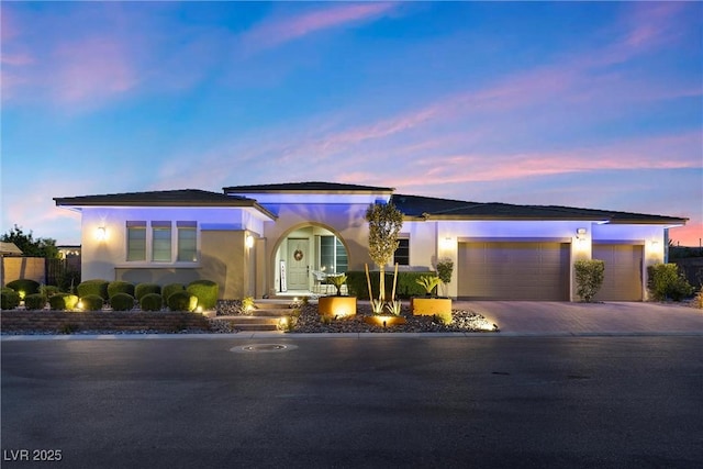 view of front of property with a garage