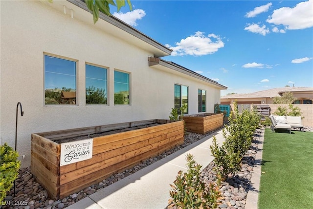 view of property exterior featuring an outdoor living space