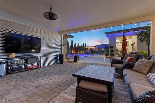 patio terrace at dusk with an outdoor hangout area