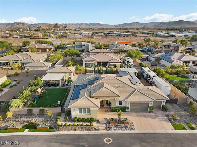 birds eye view of property featuring a mountain view