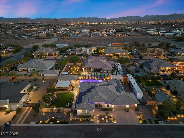 aerial view at dusk with a mountain view