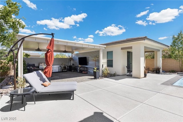 view of patio / terrace featuring ceiling fan