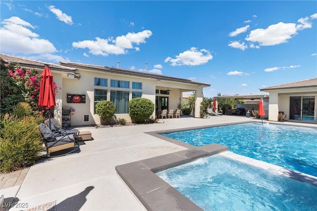 view of pool featuring a patio