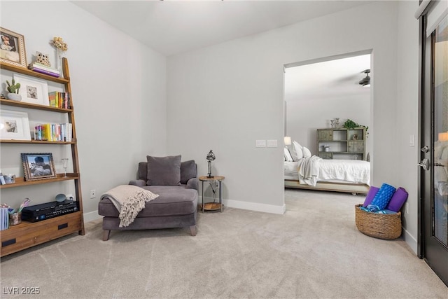 sitting room featuring light colored carpet