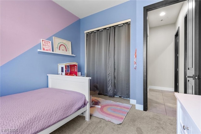 carpeted bedroom with a closet