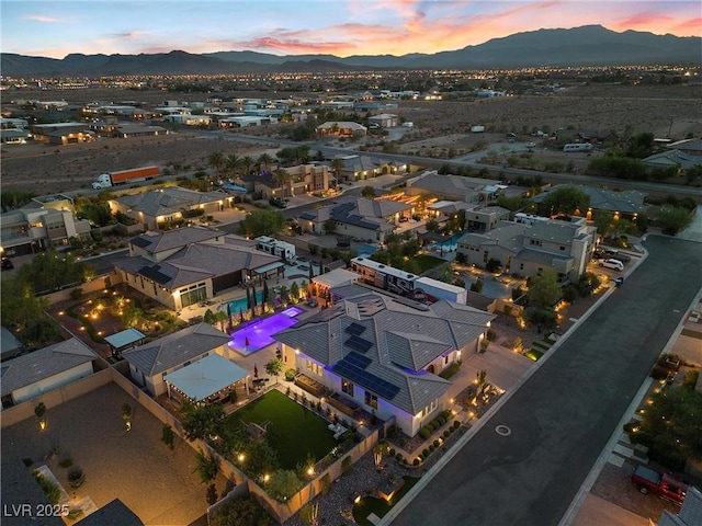 aerial view at dusk with a mountain view