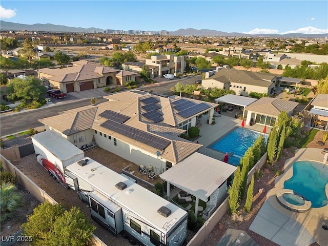 birds eye view of property featuring a mountain view