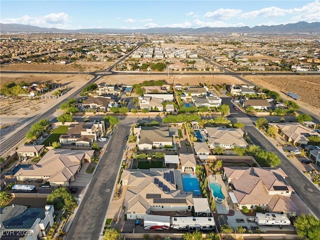 birds eye view of property with a mountain view