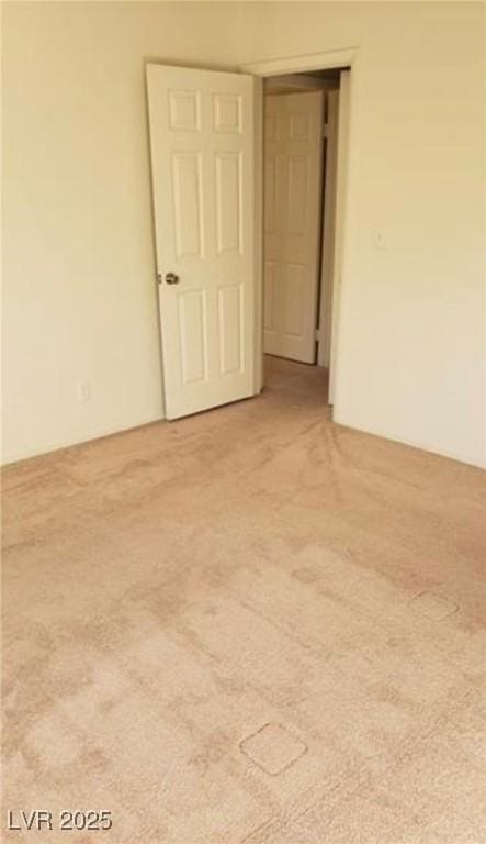 empty room featuring carpet flooring