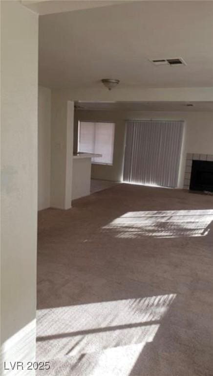 unfurnished living room with carpet flooring