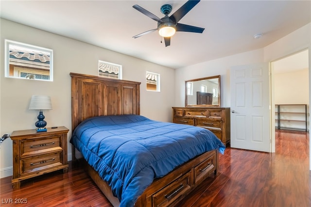 bedroom with ceiling fan and dark hardwood / wood-style floors