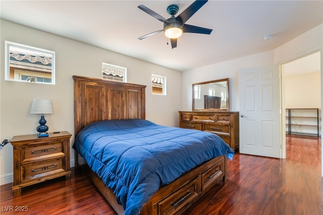 bedroom with dark wood finished floors and ceiling fan