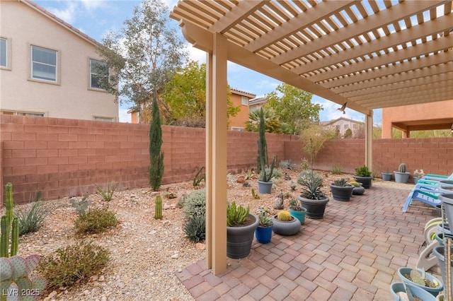view of patio / terrace featuring a fenced backyard and a pergola
