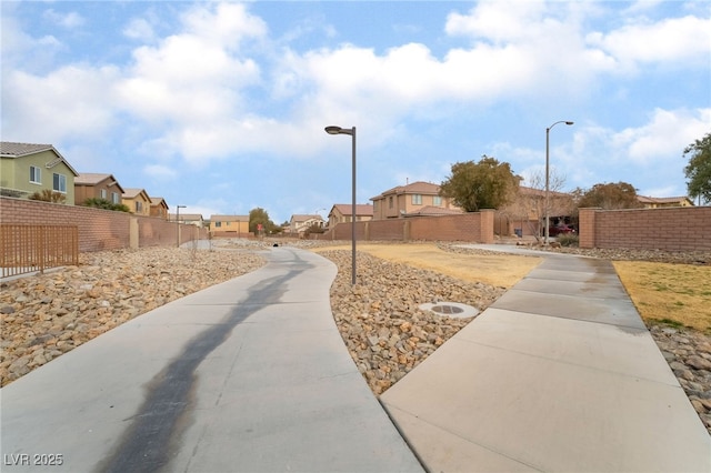 exterior space with fence and a residential view