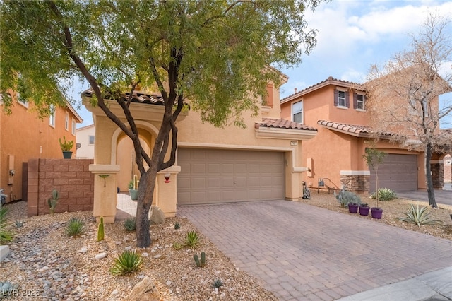 mediterranean / spanish house with a garage