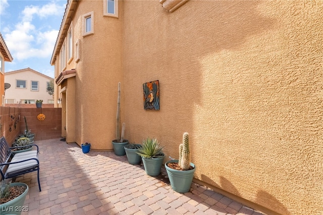 view of side of property featuring a patio