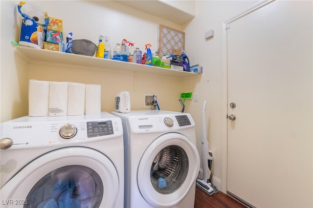 clothes washing area with independent washer and dryer and dark hardwood / wood-style floors