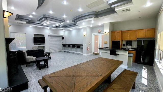 dining room with a towering ceiling