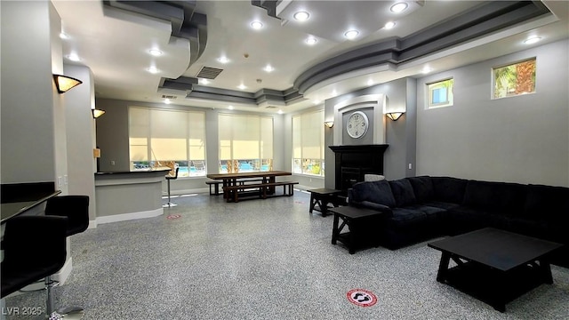 living room with a tray ceiling