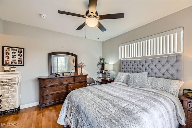 bedroom featuring ceiling fan and light wood-type flooring