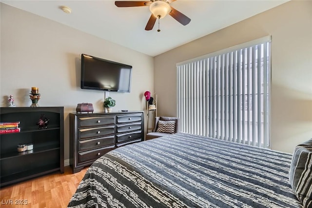 bedroom with ceiling fan and light wood-type flooring