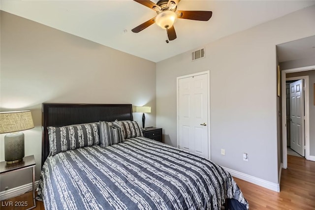 bedroom featuring hardwood / wood-style floors and ceiling fan