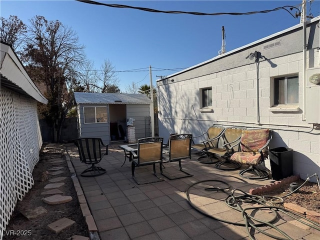 view of patio / terrace featuring a shed