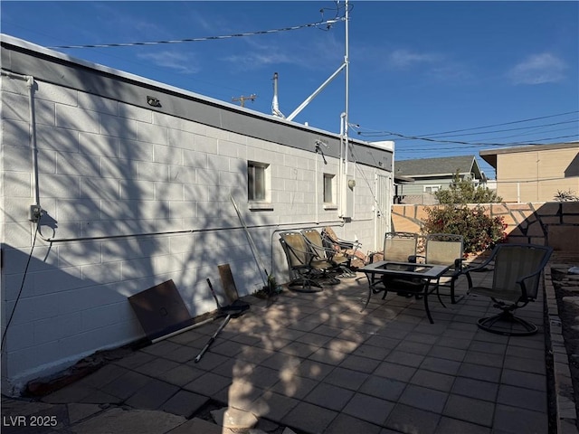 view of patio with an outdoor fire pit