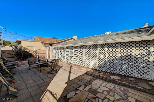 view of patio with a fire pit