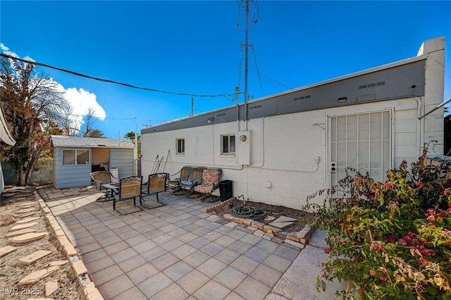 back of property featuring a patio