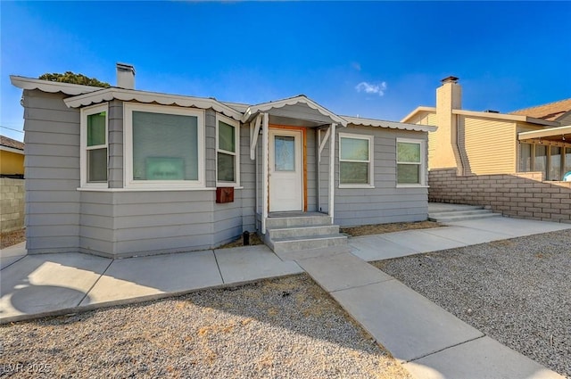 632 D, Boulder City, NV 89005 - view of front facade featuring entry steps and a chimney