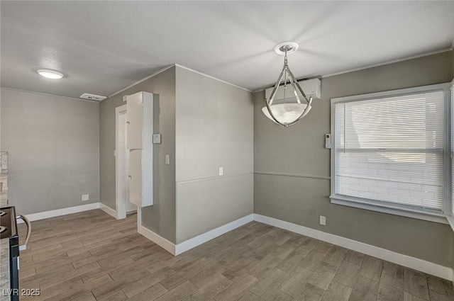 unfurnished dining area with wood-type flooring