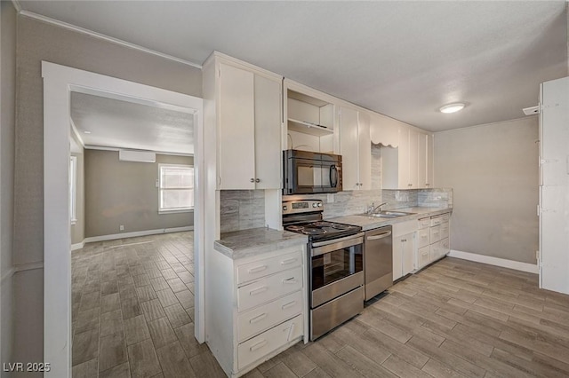 kitchen featuring sink, stainless steel appliances, ornamental molding, white cabinets, and decorative backsplash