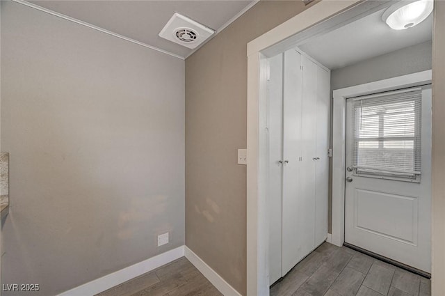 doorway to outside with light wood-type flooring