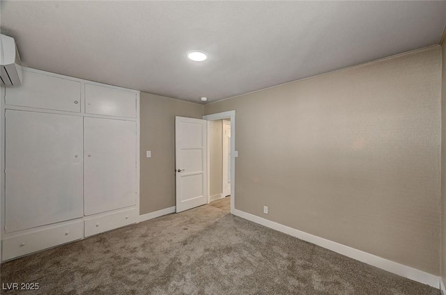 unfurnished bedroom featuring an AC wall unit and light colored carpet