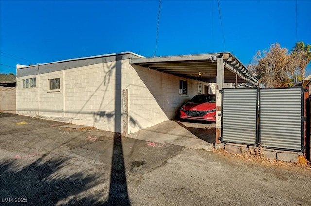 view of property exterior featuring a carport