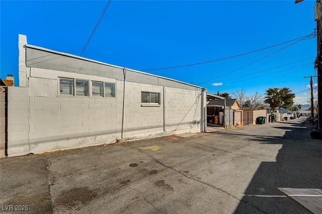 632 D, Boulder City, NV 89005 - view of side of property featuring fence and concrete block siding